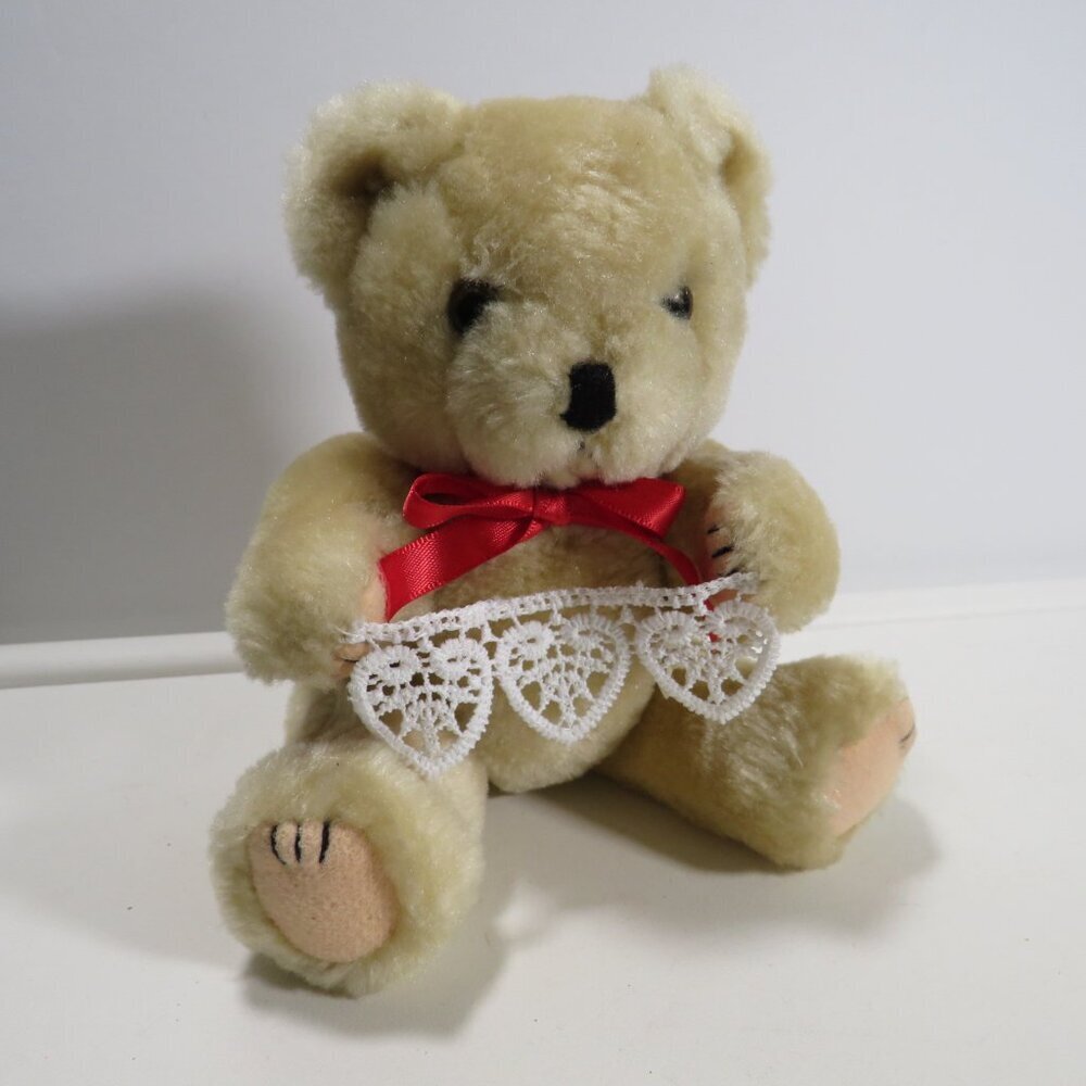 Vintage tan Teddy Bear with moveable joints with heart lace